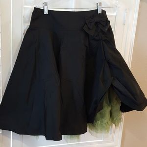 Black taffeta skirt with green petticoat